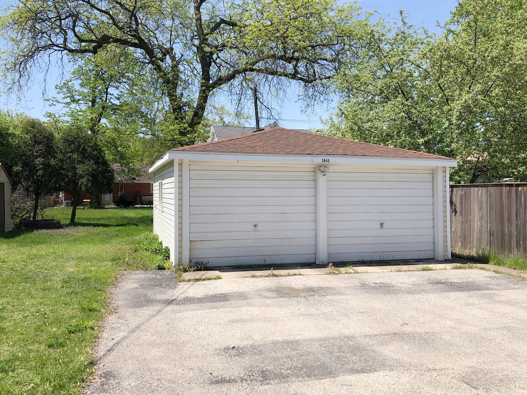 garage with a lawn