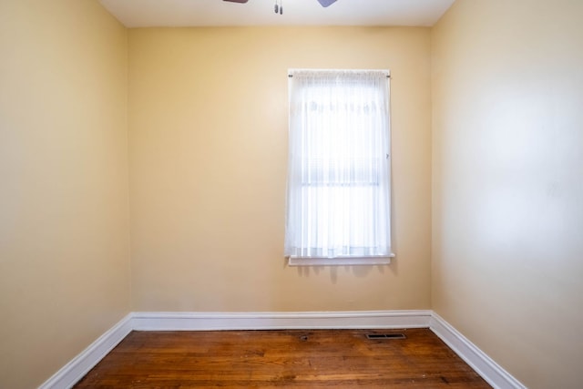 unfurnished room with hardwood / wood-style floors and ceiling fan