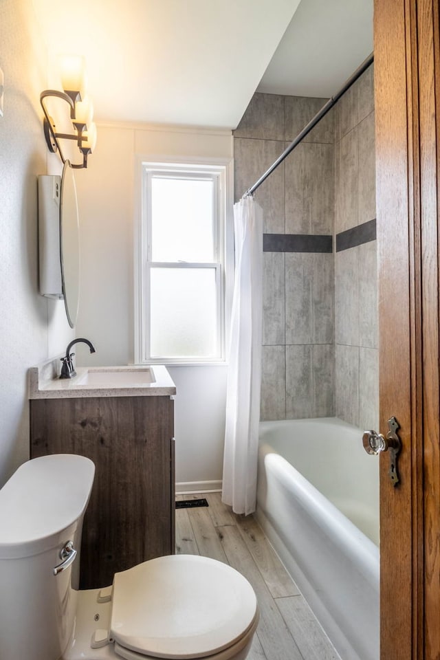 full bathroom with vanity, toilet, wood-type flooring, and shower / bath combo with shower curtain