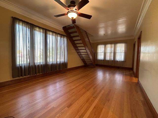 spare room featuring ornamental molding, hardwood / wood-style flooring, and ceiling fan