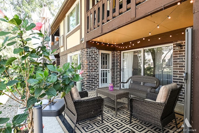 view of patio / terrace featuring a balcony and an outdoor living space