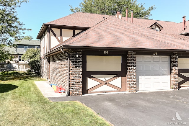 garage with a yard