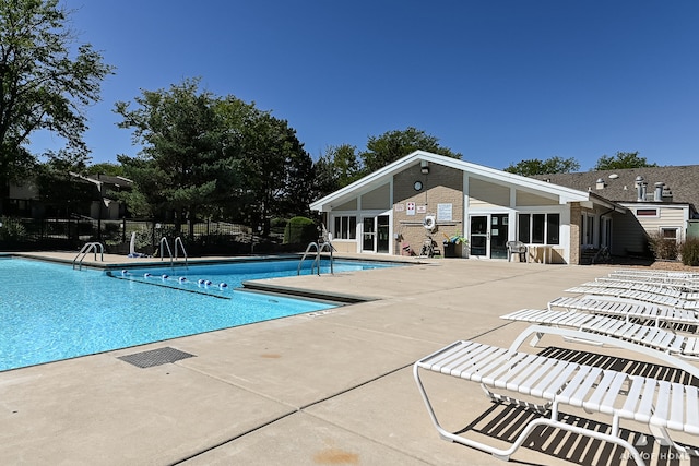 view of pool featuring a patio