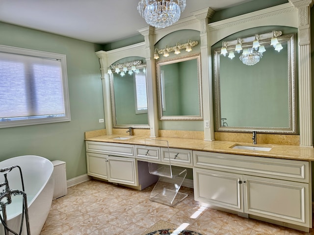 bathroom featuring a tub to relax in, vanity, and tile patterned floors