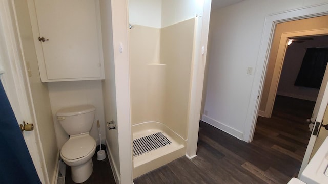 617 E Morgan St, Dixon, IL 61021 - full bathroom with a stall shower, wood finished floors, baseboards, and toilet
