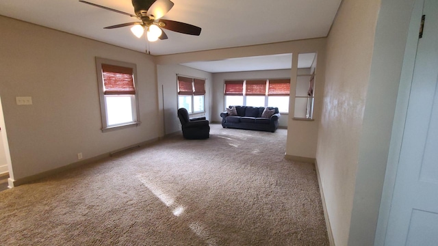 617 E Morgan St, Dixon, IL 61021 - living room featuring carpet flooring, a ceiling fan, and healthy amount of natural light