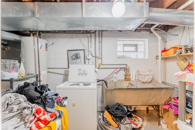 utility room with washer / dryer, water heater, and sink