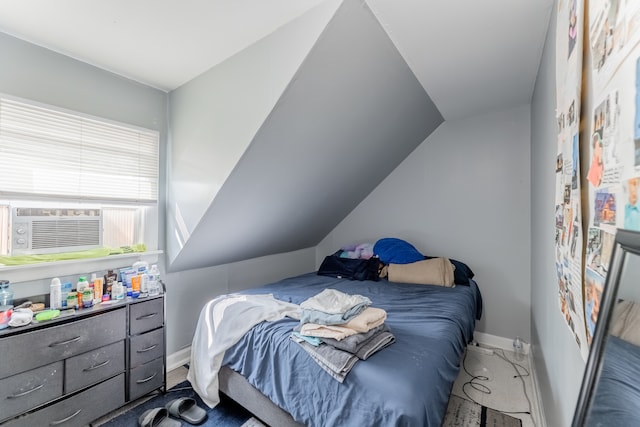 bedroom featuring lofted ceiling, carpet, and cooling unit