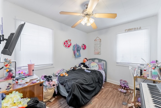 bedroom featuring hardwood / wood-style floors and ceiling fan