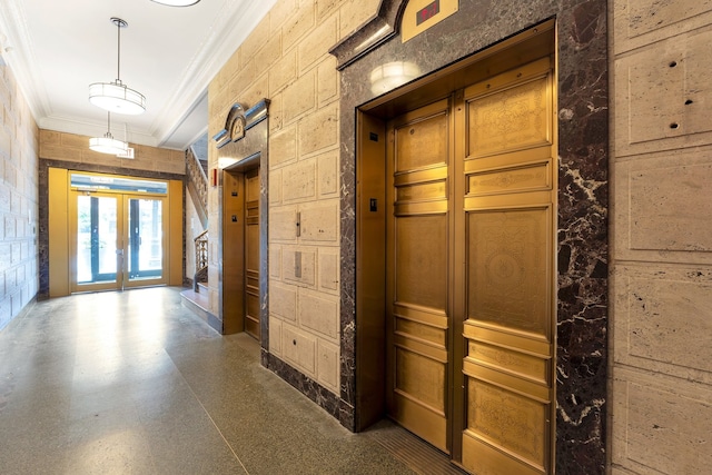 hallway featuring french doors, crown molding, and elevator