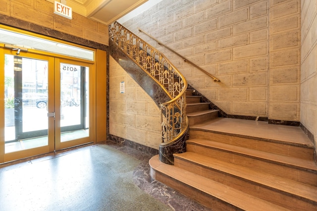 stairway featuring french doors