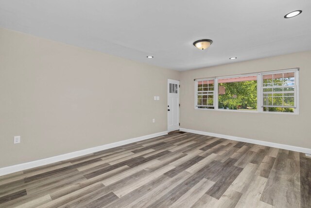 spare room featuring light wood-type flooring