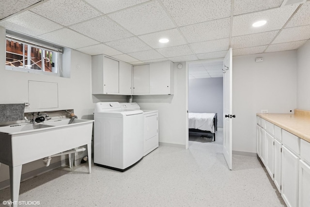 washroom featuring cabinet space, independent washer and dryer, recessed lighting, and baseboards