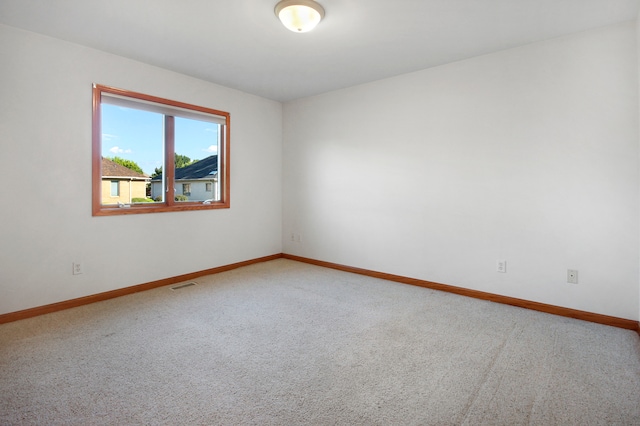 unfurnished room with carpet flooring