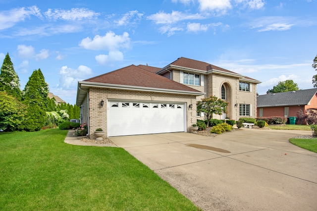 view of front of property with a garage and a front yard