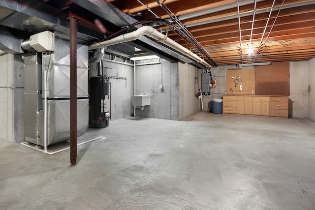 basement with water heater, heating unit, and electric panel