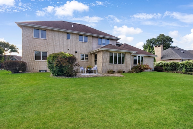 back of house featuring a yard