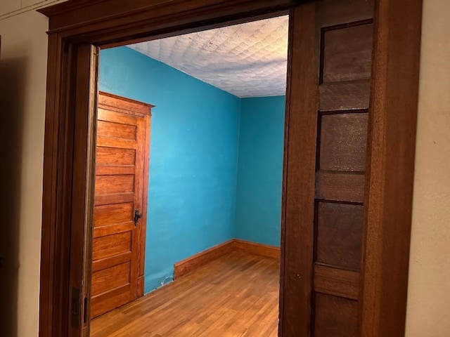 hall featuring hardwood / wood-style flooring