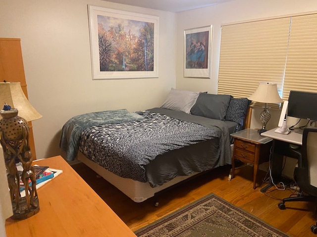 bedroom featuring wood-type flooring