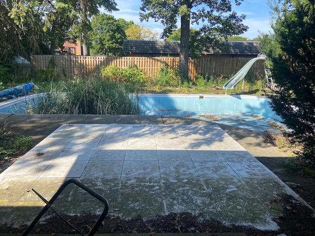 view of swimming pool featuring a water slide