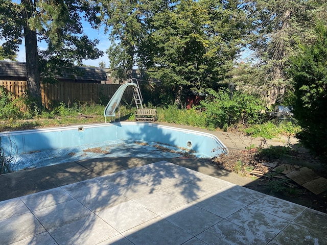 view of pool featuring a water slide