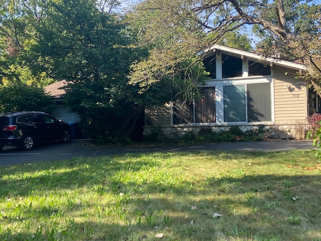 view of side of home featuring a yard