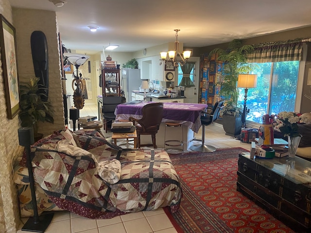 living room featuring light tile patterned floors and an inviting chandelier