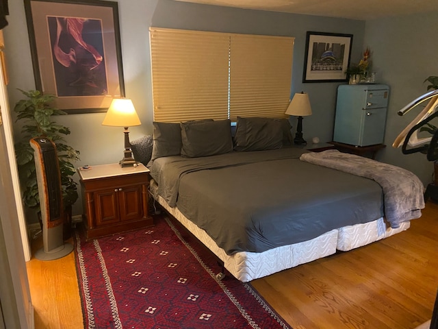 bedroom with dark wood-type flooring