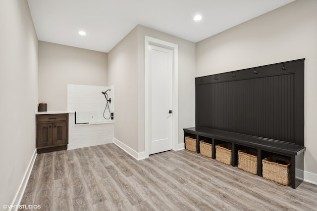 mudroom with light hardwood / wood-style flooring