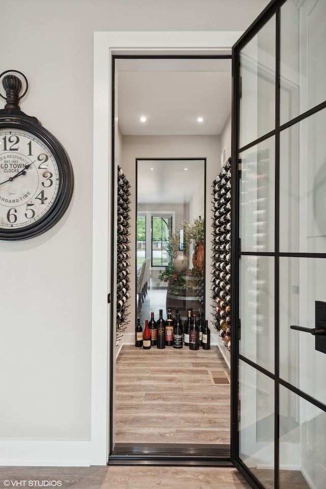 wine cellar featuring light hardwood / wood-style flooring