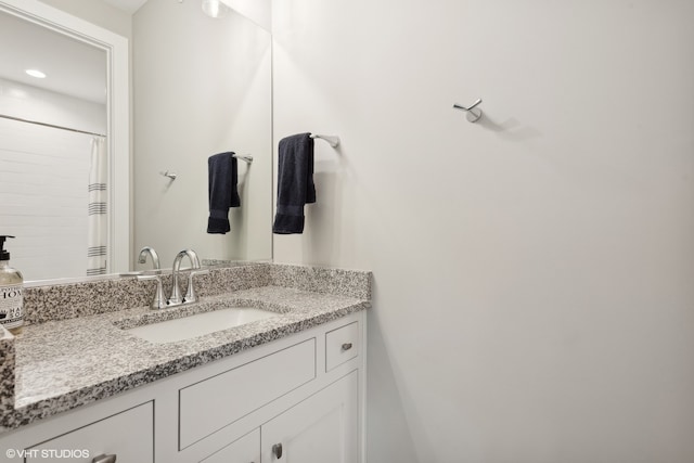 bathroom with vanity and curtained shower