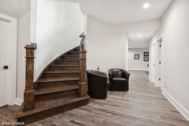 stairs with wood-type flooring