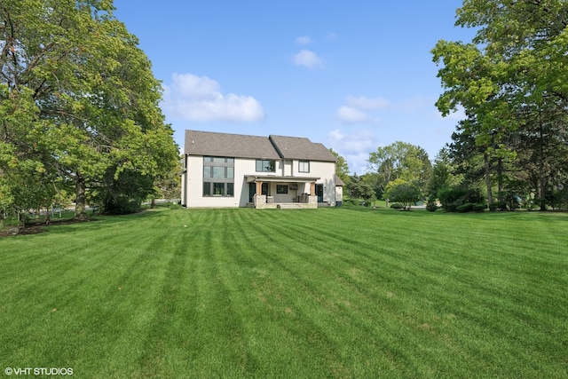 back of house with a yard