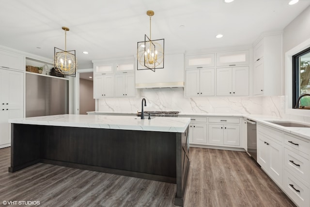 kitchen with dishwasher, dark wood-type flooring, a kitchen island with sink, sink, and white cabinetry