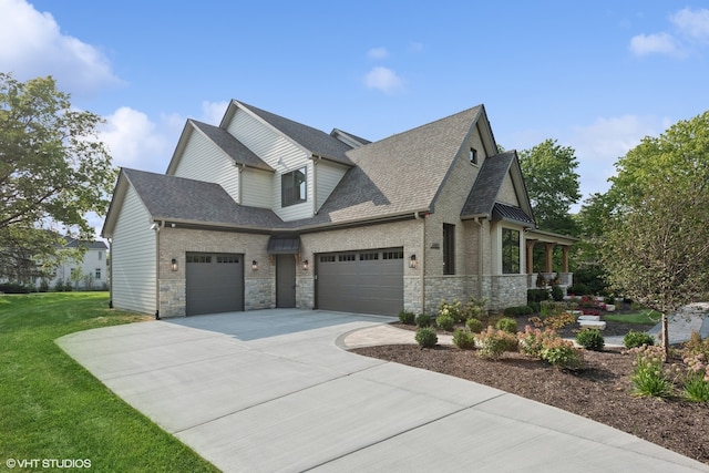 view of front of house featuring a garage and a front yard