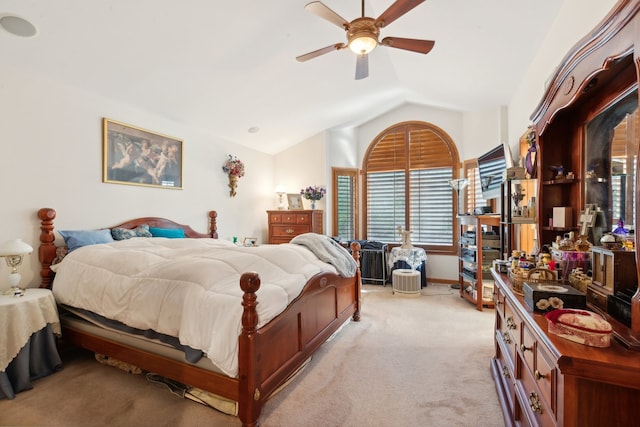 bedroom with vaulted ceiling, light carpet, and ceiling fan