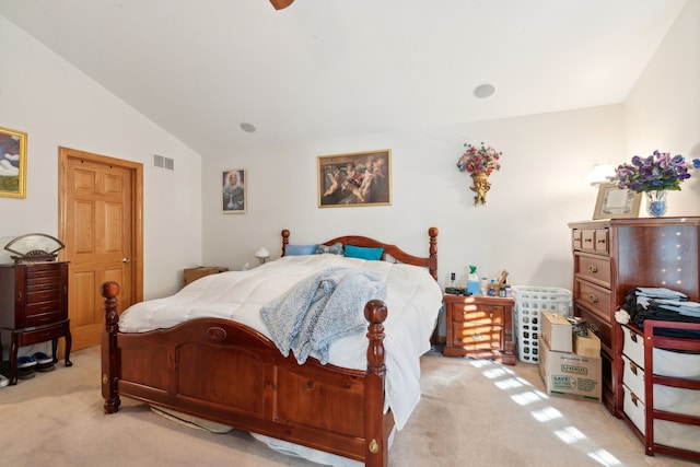 carpeted bedroom with vaulted ceiling