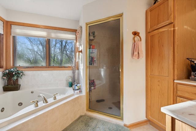 bathroom featuring separate shower and tub