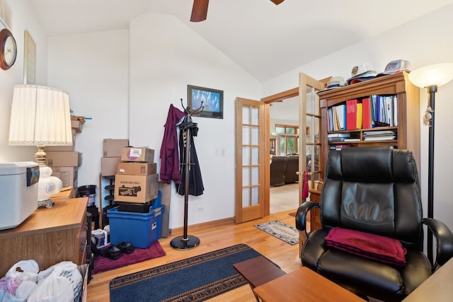 sitting room featuring french doors, hardwood / wood-style floors, ceiling fan, and vaulted ceiling