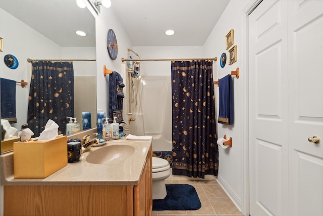 bathroom featuring toilet, vanity, and tile patterned flooring