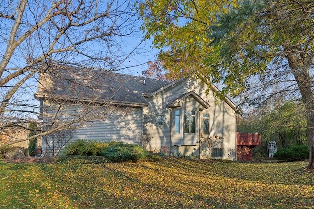 view of side of property with a yard