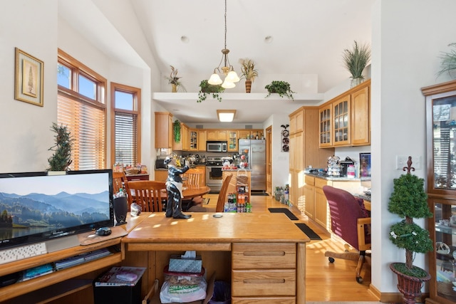 office with light hardwood / wood-style flooring and a chandelier