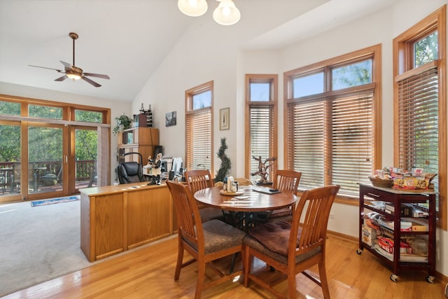 dining room featuring a wealth of natural light, ceiling fan, and light hardwood / wood-style flooring