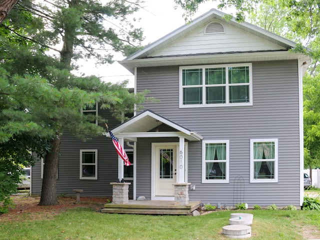 view of front of home featuring a porch and a front lawn