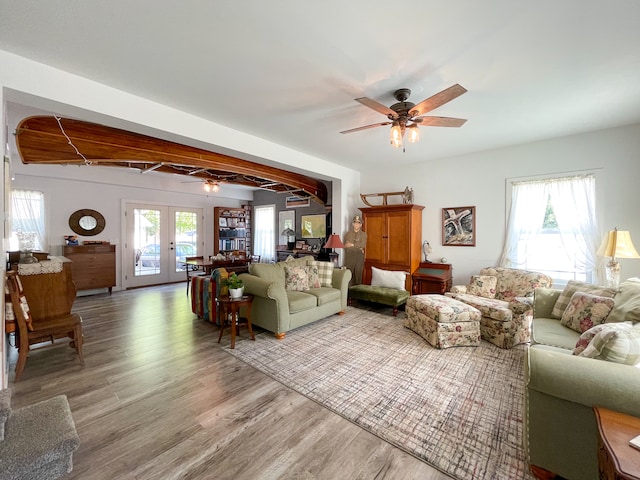 living room with french doors, hardwood / wood-style flooring, and ceiling fan