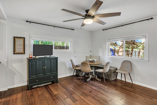 dining area with dark hardwood / wood-style flooring, a wealth of natural light, and ceiling fan