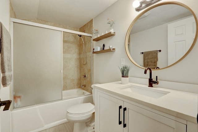 full bathroom featuring vanity, toilet, and tiled shower / bath combo