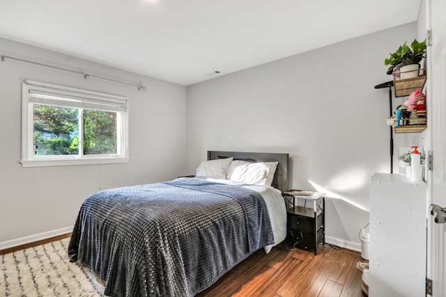 bedroom featuring dark hardwood / wood-style floors