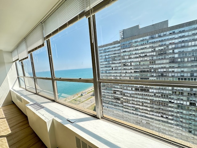 balcony featuring a water view