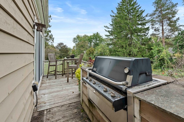 wooden terrace with grilling area